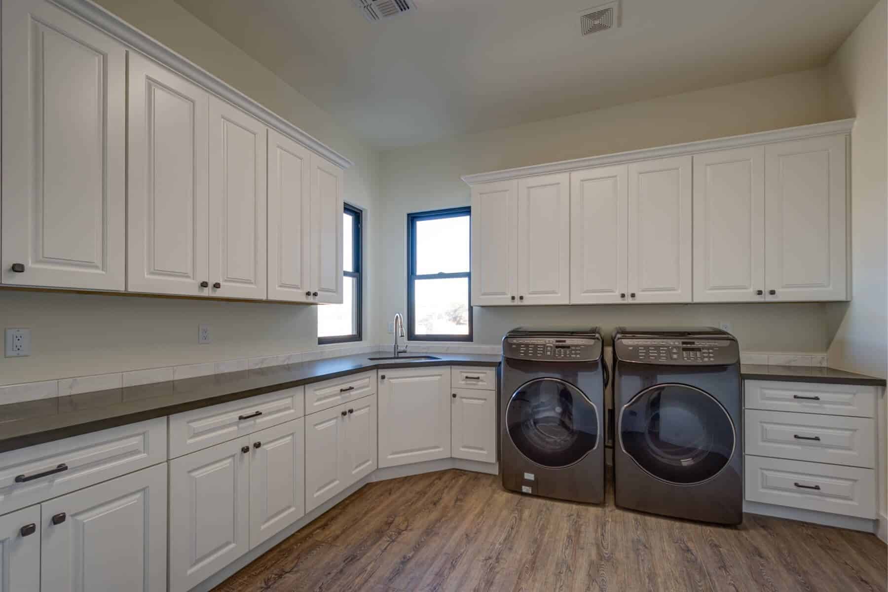 & Stone Executive Home New Construction Utility Laundry Room